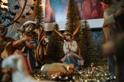a nativity scene with figurines and trees