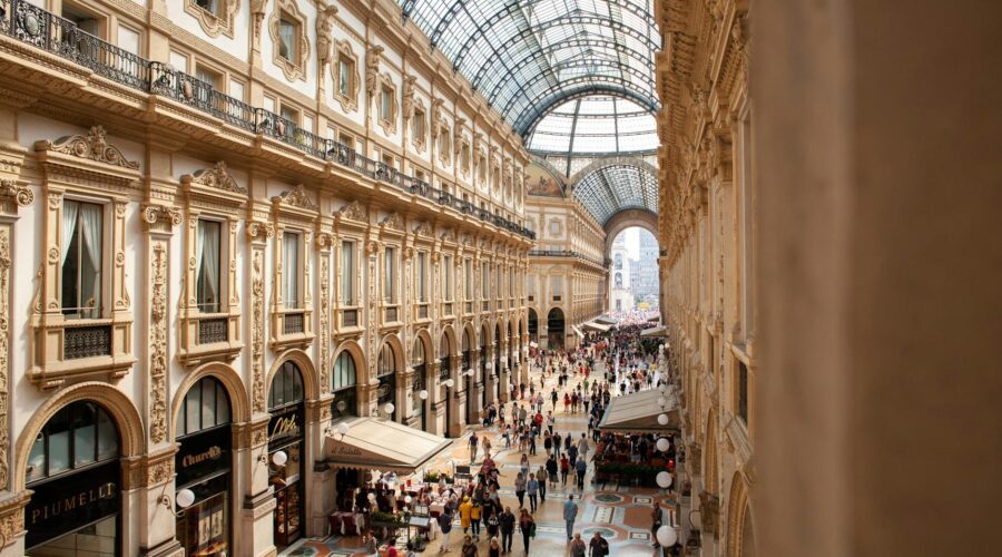 people inside galleria vittorio emanuele ii shopping mall in italy