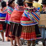 view of a group of people on a street wearing traditional folk costumes